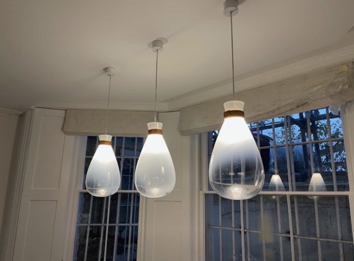 Glass pendant lighting installed over a bay window by EMI Electrical